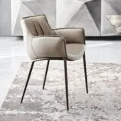 Distinguished Cattelan Italia Rhonda armchair with neutral beige fabric and embossed lacquered steel base appearing satin-finished