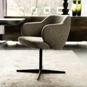 Sophisticated Cattelan Italia Bombè X armchair with muted gray textured fabric upholstery and embossed lacquered dark steel base