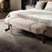 Elegant DV Home Collection Coco bench with neutral beige upholstery and warm bronze-toned steel legs