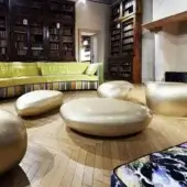 Exclusive Erba Invece coffee table crafted in Italy with patented polymeric material and glossy pale tone