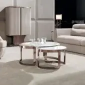 Distinguished DV Home Collection Coco coffee table with rounded form and Calacatta Royal marble top in reflective rose-gold-toned steel base