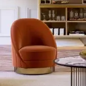 Superior Vismara Capsule lounge chair with warm orange textile upholstery and rotating glossy steel base