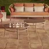 Elegant Varaschin Emma Cross coffee table with bush-hammered ceramic tabletop and dark textured synthetic fiber rope frame