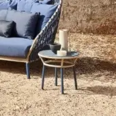 Superior Varaschin Emma Cross side table with a round bush-hammered ceramic top and powder-coated aluminum interwoven with tan synthetic fiber rope