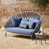 Exceptional Varaschin Emma Cross daybed with woven acrylic Band fabric and plush blue cushions in a powder-coated aluminum frame
