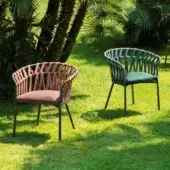 Distinguished Varaschin Emma Cross armchair with reddish-brown woven fiber rope and acrylic band, built with a powder-coated aluminum frame