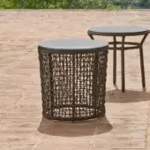 Distinguished Varaschin Emma side table with a refined hpl top and dark brown textured hand-woven powder coated aluminum frame