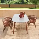 Refined Varaschin Emma table with a light grey Hpl top and reddish-brown powder-coated aluminum frame built with sleek tapered metal legs