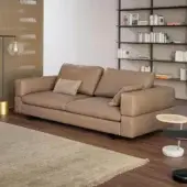 Elegant Bonaldo Ever More sofa with smooth light brown leather upholstery and low dark metal legs