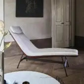 Refined Bonaldo Alpilles chaise lounge with light gray woven textile and brown leather trim, built with a matt painted metal base