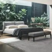 Superior Bonaldo Kriss bed with upholstered headboard and dark slender legs in light gray textile construction