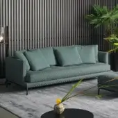 Superior Bonaldo Soft Island sofa with deep tufted seat in muted teal textile and subtle metal feet