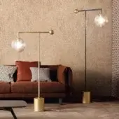 Distinguished Bonaldo Bardot floor lamp with a geometric metal structure and transparent glass globe in gold finish