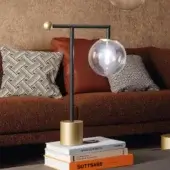 Superior Bonaldo Bardot table lamp with a geometric lead metal structure and clear glass lampshade
