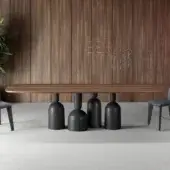 Refined Bonaldo Cop table with a racetrack-shaped wooden top and striking painted metal base in bottle-inspired elements with a smooth medium-brown finish