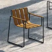 Distinguished Royal Botania Strappy armchair with tan seating straps and matte black coated stainless steel frame