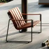 Captivating Royal Botania Strappy lounge chair with coated stainless steel and brown eco-leather straps in a matte black finish