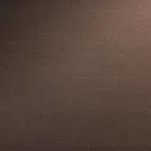 Bronze metal texture with mottled, irregular pattern and warm tones, exhibiting a brushed finish and matte surface with diffused lighting.