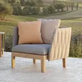 Exceptional Royal Botania Calypso lounge chair with light beige quilted textile upholstery and stainless steel base