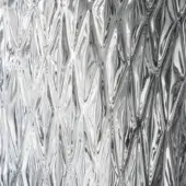 Crumpled aluminum foil, silvery-white, with undulating waves and sharp creases creating a dynamic, reflective texture and diffused lighting.