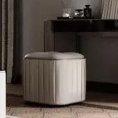Distinguished Reflex Plissé ottoman upholstered in light beige pleated fabric with satin brass finish
