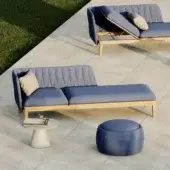 Distinguished Royal Botania Calypso lounger with reclining teak base and quilted cool blue textile upholstery paired with stainless steel