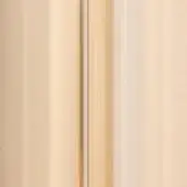 Amber glass panel with vertical striations and ribbed texture, featuring a dark gray seam and translucent honey to deep amber tones.