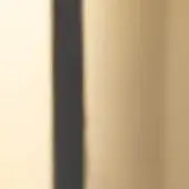 Dark metal pillar with smooth finish against warm beige and gold gradient background, soft diffused lighting.