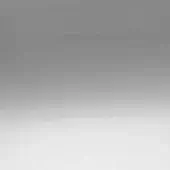 Gray gradient background transitions from dark to light, creating a smooth, monochromatic composition with diffused lighting and minimalist structure.