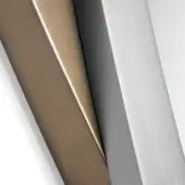 Brushed brass and titanium metal panels intersect diagonally, showcasing warm gold and cool silver tones with linear textures against a white backdrop.