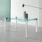 Distinguished Tonelli Design Livingstone table with clear glass tabletop and matte white metal legs built with a stainless steel zipper mechanism
