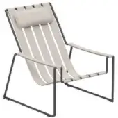 Lounger chair, dark gray metal frame, light beige fabric straps, triangular base, angled armrests, rectangular headrest cushion, minimalist design.