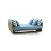 Outdoor chaise lounge, woven rattan frame, light-blue upholstery, striped pillows, rectangular shape, low profile, studio product shot.
