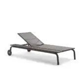 Chaise lounge, dark gray metal frame, woven light tan seat with adjustable backrest and mesh support for outdoor use.