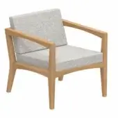 Low armchair with light wood frame and gray fabric cushion, featuring angular lines, tapered legs, and a minimalist design.