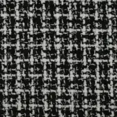 Black and white tweed fabric texture displaying a dense, square pattern from interwoven yarns with a slightly rough, nubby surface.