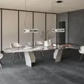 Captivating Cattelan Italia Senator table with irregularly shaped glass and asymmetrical metal bases in dark gray with veined accents and beveled edges