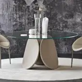 Exceptional Cattelan Italia Maxim table with sculptural cement base and clear glass top in a spatuated finish