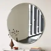 Distinguished Cattelan Italia Hawaii mirror with beveled edges and glossy metallic-looking framed reflective glass