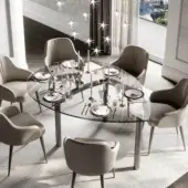 Distinguished Reflex Policleto table with shaped tempered glass top and brushed stainless steel central support