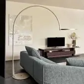 Exceptional Cattelan Italia Arx floor lamp with arched form crafted in embossed lacquered steel and smooth finish