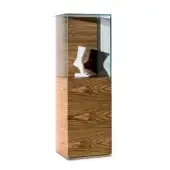 Wood display case with vertical grain, clear glass cube enclosure, and two white mannequin feet on a dark base.
