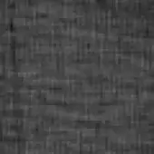 Granular gray texture composed of irregular blocks, displaying mottled shades from charcoal to mid-gray with a woven, matte finish.