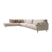 Beige modular sectional sofa with chaise, rounded arms, metal legs, and three brown-gold velvet pillows against a white backdrop.
