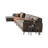 Modular sofa, gray-brown textured fabric, L-shape sectional with chaise, rust pillows and throw, dark metal legs and side table.