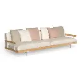 Beige modular sofa with oak frame, wide cushions, rounded arms, and five throw pillows in blush pink, olive green, and patterned beige.