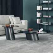 Distinctive Bonaldo Pisa coffee table with curvilinear metal base and dark reflective glass top in matte finish