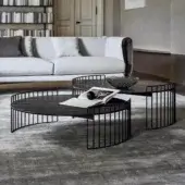 Superior Bonaldo Harpe coffee table with matte black metal base and dark stone-like tabletop exhibiting subtle light veining