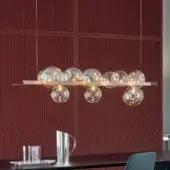 Distinguished Bonaldo Bon Ton suspension lamp with eleven glass lampshades—four amber and seven transparent—mounted on a metal bar