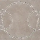 Beige suede textile with stitched white circles, displaying a hand-stitched overlapping pattern and soft, fuzzy texture; labeled “nabuk rings”.